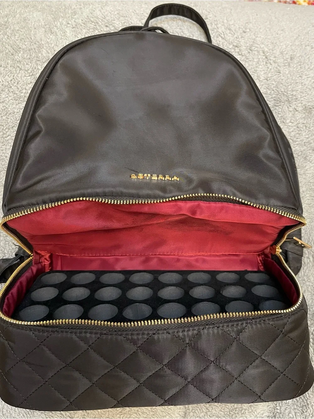 Doterra Black Quilted-Bottom Backpack with Gold Accents